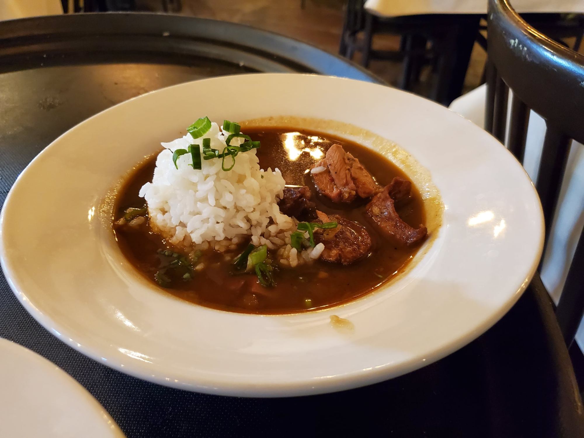 a bowl of soup sitting on a plate