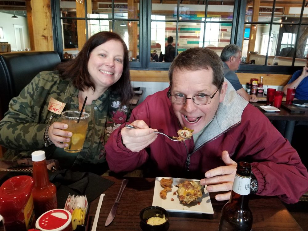 a woman sitting at a table eating food